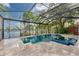 Beautiful screened pool with spa overlooking the lake at 15012 Maurine Cove Ln, Odessa, FL 33556