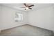 Neutral bedroom with carpet flooring and a window at 16039 Frost Dr, Hudson, FL 34667