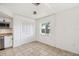 Kitchen nook with white cabinets, stainless appliances, tile floors and bright window at 16039 Frost Dr, Hudson, FL 34667
