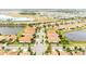 This aerial view shows a well-planned community with beautiful homes and tranquil ponds throughout at 16831 Banner Shell Pl, Wimauma, FL 33598