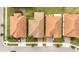 Overhead view showcasing residential properties, well-kept lawns, mature trees, and neighborhood street layout at 16831 Banner Shell Pl, Wimauma, FL 33598