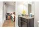 Bathroom with granite counters and adjacent bedroom at 16831 Banner Shell Pl, Wimauma, FL 33598