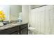 Cozy bathroom featuring granite countertops and a shower-tub combo at 16831 Banner Shell Pl, Wimauma, FL 33598
