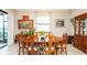 Formal dining room featuring an ornate wood table with seating for eight and a view of the outdoors at 16831 Banner Shell Pl, Wimauma, FL 33598