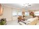 Bright living room with tile floors, neutral tones, and natural light, creating a warm and inviting space at 16831 Banner Shell Pl, Wimauma, FL 33598