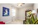 Bright living space with a display cabinet, tiled flooring, and a view of a window with curtains at 16831 Banner Shell Pl, Wimauma, FL 33598
