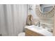 Bathroom highlighting marble vanity, decorative mirror, and neutral accents at 1847 Shore Drive S # 415, South Pasadena, FL 33707