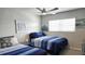 Comfortable bedroom featuring twin beds, coastal decor, and soothing color tones for a restful atmosphere at 1847 Shore Drive S # 415, South Pasadena, FL 33707