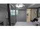 Bedroom featuring natural light, a view to an ensuite bathroom, and neutral colors at 1847 Shore Drive S # 415, South Pasadena, FL 33707