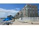 A view of the condo from the water, with a pool and deck nearby at 1847 Shore Drive S # 415, South Pasadena, FL 33707