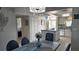 Charming kitchen featuring a breakfast bar, white cabinets, and an open layout connecting to the dining area at 1847 Shore Drive S # 415, South Pasadena, FL 33707