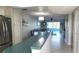 Bright kitchen featuring stainless steel appliances, breakfast bar, and an open view to the living area at 1847 Shore Drive S # 415, South Pasadena, FL 33707