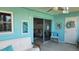 Cozy lanai with comfortable seating and view to living room at 1847 Shore Drive S # 415, South Pasadena, FL 33707