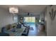 Inviting living room with stylish decor, comfortable seating, and access to a sunroom with scenic views at 1847 Shore Drive S # 415, South Pasadena, FL 33707