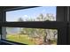 Stunning view from the window with trees, sky, and blue water at 1847 Shore Drive S # 415, South Pasadena, FL 33707