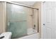 Bathroom featuring a shower and tub combination with sliding glass door at 1881 Lichen Ln # B, Clearwater, FL 33760