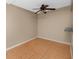 Bright dining area featuring terra cotta tile flooring and ceiling fan at 1881 Lichen Ln # B, Clearwater, FL 33760