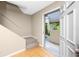 Welcoming entryway with terra cotta tile flooring leading to a staircase at 1881 Lichen Ln # B, Clearwater, FL 33760