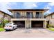 Charming two-story condo with a private balcony, two-car garage, and well-maintained grounds at 1881 Lichen Ln # B, Clearwater, FL 33760