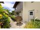 Inviting condo exterior showcasing a private entrance with well-maintained landscaping at 1881 Lichen Ln # B, Clearwater, FL 33760