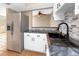 Stylish kitchen featuring stainless steel appliances, sleek countertops, and backsplash details at 1881 Lichen Ln # B, Clearwater, FL 33760
