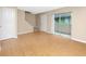 Open-concept living area with a sliding glass door to a patio and staircase at 1881 Lichen Ln # B, Clearwater, FL 33760