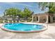 Community pool with lounge chairs and a covered seating area, perfect for relaxation and recreation at 1881 Lichen Ln # B, Clearwater, FL 33760