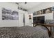 Spacious bedroom featuring a ceiling fan and unique decorations on the walls at 19104 Cellini Pl, Lutz, FL 33558