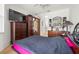 Bedroom featuring hardwood floors and a large dresser with a TV on top at 19104 Cellini Pl, Lutz, FL 33558