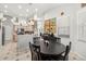 View of the dining area, kitchen, and decor in the background at 19104 Cellini Pl, Lutz, FL 33558