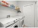 Laundry room featuring modern appliances and ample storage space at 19104 Cellini Pl, Lutz, FL 33558