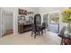 Open living space with tiled floors, decor, and sliding glass doors leading to the pool area at 19104 Cellini Pl, Lutz, FL 33558