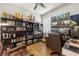 Well-appointed home office with a ceiling fan, built-in bookshelves, and ample lighting at 19104 Cellini Pl, Lutz, FL 33558