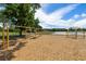 The playground features a variety of swings and climbing structures for children to enjoy outdoor playtime at 19104 Cellini Pl, Lutz, FL 33558