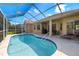 A screened-in pool offers the perfect spot for outdoor relaxation and entertainment with ample seating space at 19104 Cellini Pl, Lutz, FL 33558