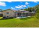 Aerial view of a screened-in pool, providing a private oasis and a beautiful addition to the home's backyard at 19104 Cellini Pl, Lutz, FL 33558