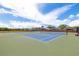 Scenic view of the community tennis courts on a sunny day with lush green surroundings at 19104 Cellini Pl, Lutz, FL 33558