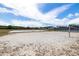 The outdoor volleyball court provides a dedicated space for sports and recreational activities at 19104 Cellini Pl, Lutz, FL 33558