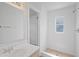 Modern bathroom featuring a tiled shower with a glass door, complemented by a sleek vanity area at 212 Gay Rd, Seffner, FL 33584