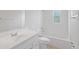 Clean, bright bathroom with a classic white tub and tiled surround, offering a functional and stylish design at 212 Gay Rd, Seffner, FL 33584