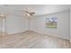 Spacious bedroom with light wood flooring, freshly painted white walls, and a bright, open feel at 212 Gay Rd, Seffner, FL 33584