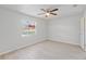 Bright bedroom featuring new floors, modern fan and a sunlit window at 212 Gay Rd, Seffner, FL 33584