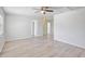 Spacious living room filled with natural light, complemented by elegant wood-look flooring for a modern touch at 212 Gay Rd, Seffner, FL 33584