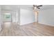 Open-concept living room area showcasing light hardwood flooring, white walls and an open floor plan at 212 Gay Rd, Seffner, FL 33584