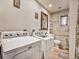 The laundry room is equipped with a washer and dryer at 2160 Ne Coachman Rd, Clearwater, FL 33765