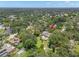 Overhead shot features a sprawling lawn, mature trees, swimming pool, and private backyard at 2306 S Valrico Rd, Valrico, FL 33596