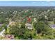 Discover this home via aerial view, highlighting the swimming pool, trampoline, and spacious yard at 2306 S Valrico Rd, Valrico, FL 33596
