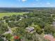 Aerial view of home showcases a huge lot, mature trees, and a peaceful neighborhood setting at 2306 S Valrico Rd, Valrico, FL 33596
