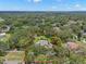 Expansive property aerial view features a lush, oversized lot with mature trees, swimming pool, and private backyard at 2306 S Valrico Rd, Valrico, FL 33596