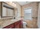 Bathroom featuring a granite countertop, a window and a shower with a decorative curtain at 2306 S Valrico Rd, Valrico, FL 33596